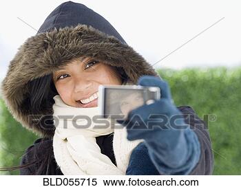 Stock Image - pacific islander 
woman taking own 
photograph. fotosearch 
- search stock 
photos, pictures, 
images, and photo 
clipart