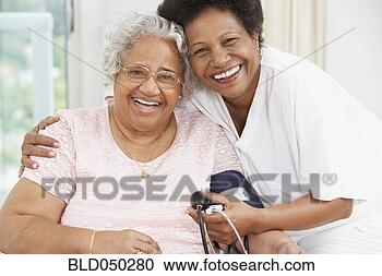Stock Photography - african american 
mother and adult 
daughter smiling 
at each other. 
fotosearch - search 
stock photos, 
pictures, images, 
and photo clipart