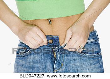 Picture - close up of hispanic 
woman buttoning 
pants. fotosearch 
- search stock 
photos, pictures, 
images, and photo 
clipart