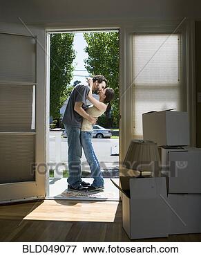 Picture - ethnic-ethnic 
couple kissing 
in doorway. fotosearch 
- search stock 
photos, pictures, 
images, and photo 
clipart