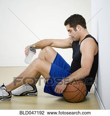 Stock Photo - hispanic man in 
athletic gear 
with basketball. 
fotosearch - search 
stock photos, 
pictures, images, 
and photo clipart