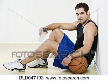 Stock Photo - hispanic man in 
athletic gear 
with basketball. 
fotosearch - search 
stock photos, 
pictures, images, 
and photo clipart