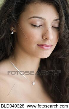 Stock Photo - hispanic teenaged 
girl with eyes 
closed. fotosearch 
- search stock 
photos, pictures, 
images, and photo 
clipart