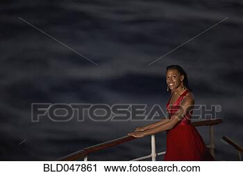 Stock Photography - mixed race women 
at ship railing. 
fotosearch - search 
stock photos, 
pictures, images, 
and photo clipart