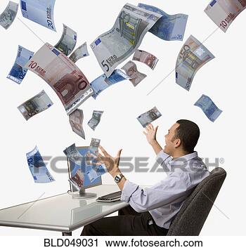 Stock Photography - money flying out 
of asian man’s 
computer. fotosearch 
- search stock 
photos, pictures, 
images, and photo 
clipart