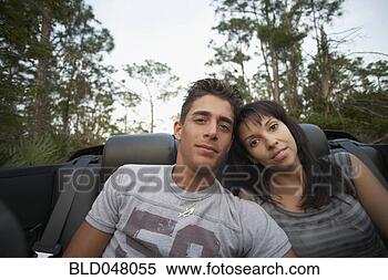 Stock Image - multi-ethnic couple 
in back seat of 
convertible. fotosearch 
- search stock 
photos, pictures, 
images, and photo 
clipart