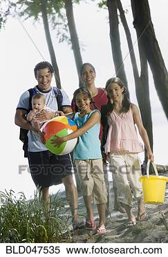 Stock Image - multi-ethnic family 
at beach. fotosearch 
- search stock 
photos, pictures, 
images, and photo 
clipart