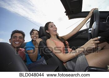 Stock Photo - multi-ethnic friends 
driving in convertible. 
fotosearch - search 
stock photos, 
pictures, images, 
and photo clipart