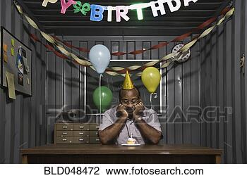 Stock Photo - senior african 
american male 
worker staring 
at birthday cupcake. 
fotosearch - search 
stock photos, 
pictures, images, 
and photo clipart