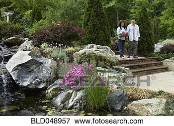Picture - senior asian couple 
in garden. fotosearch 
- search stock 
photos, pictures, 
images, and photo 
clipart