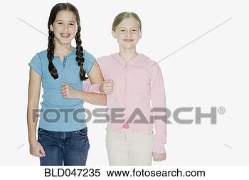 Stock Image - young girls standing 
arm in arm. fotosearch 
- search stock 
photos, pictures, 
images, and photo 
clipart