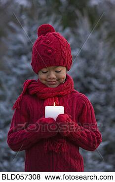 Stock Photo - african girl holding 
lit candle. fotosearch 
- search stock 
photos, pictures, 
images, and photo 
clipart