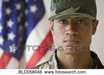 Stock Photo - african male soldier 
in front of american 
flag. fotosearch 
- search stock 
photos, pictures, 
wall murals, images, 
and photo clipart