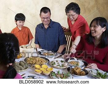 Stock Photo - asian family eating 
at dinner table. 
fotosearch - search 
stock photos, 
pictures, images, 
and photo clipart
