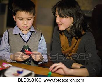 Stock Photography - asian mother and 
son making origami. 
fotosearch - search 
stock photos, 
pictures, images, 
and photo clipart
