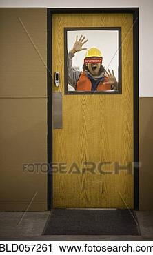 Stock Photography - asian warehouse 
worker yelling 
through door. 
fotosearch - search 
stock photos, 
pictures, images, 
and photo clipart