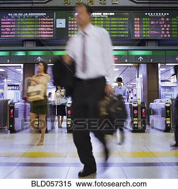 Stock Image - blurred motion 
shot of asian 
businessman in 
subway. fotosearch 
- search stock 
photos, pictures, 
images, and photo 
clipart