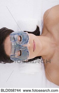 Stock Photo - hispanic woman 
wearing gel face 
mask. fotosearch 
- search stock 
photos, pictures, 
images, and photo 
clipart