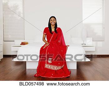 Stock Photo - indian woman wearing 
traditional dress. 
fotosearch - search 
stock photos, 
pictures, images, 
and photo clipart