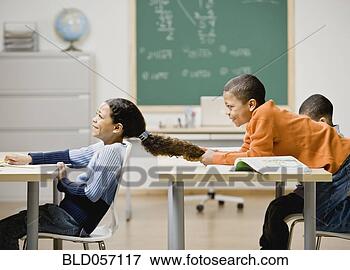 Picture - mixed race boy 
pulling girl’s 
hair in school. 
fotosearch - search 
stock photos, 
pictures, images, 
and photo clipart