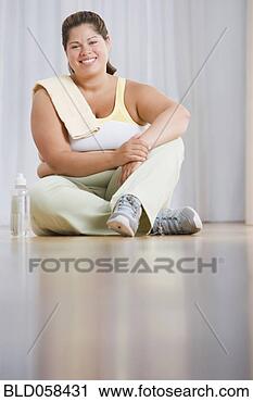 Stock Photography - overweight hispanic 
woman in athletic 
gear. fotosearch 
- search stock 
photos, pictures, 
images, and photo 
clipart