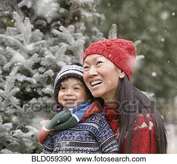 Stock Photography - asian mother and 
son in snow. fotosearch 
- search stock 
photos, pictures, 
images, and photo 
clipart