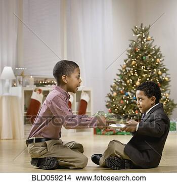 Stock Photo - mixed race brothers 
fighting over 
christmas gift. 
fotosearch - search 
stock photos, 
pictures, images, 
and photo clipart
