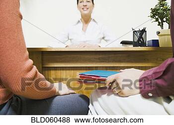 Stock Photo - mixed race businesswoman 
talking to clients. 
fotosearch - search 
stock photos, 
pictures, images, 
and photo clipart