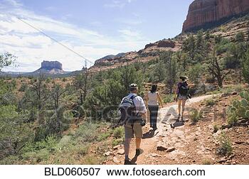 Picture - multi-ethnic people 
hiking in desert. 
fotosearch - search 
stock photos, 
pictures, images, 
and photo clipart