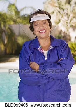 Stock Photo - senior hispanic 
woman with arms 
crossed. fotosearch 
- search stock 
photos, pictures, 
images, and photo 
clipart