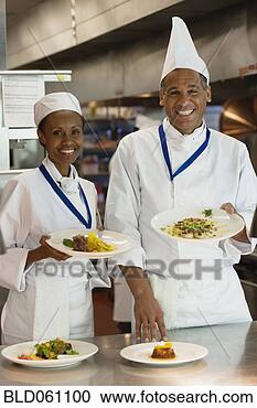 Stock Photography - african chefs 
holding plates 
of food. fotosearch 
- search stock 
photos, pictures, 
images, and photo 
clipart