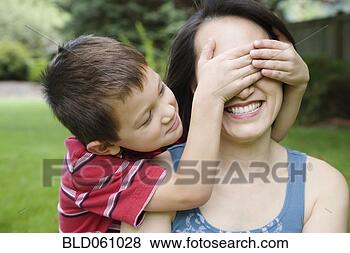 Stock Photo - asian boy covering 
mother’s eyes. 
fotosearch - search 
stock photos, 
pictures, images, 
and photo clipart