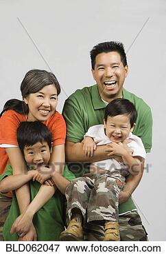 Picture - asian parents 
hugging children. 
fotosearch - search 
stock photos, 
pictures, images, 
and photo clipart