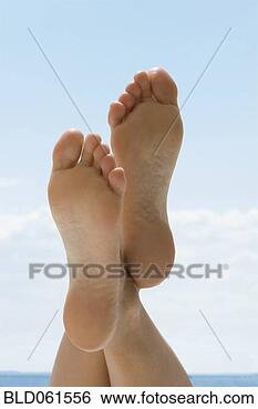 Stock Photo - asian woman’s 
bare feet crossed 
at ankle. fotosearch 
- search stock 
photos, pictures, 
images, and photo 
clipart