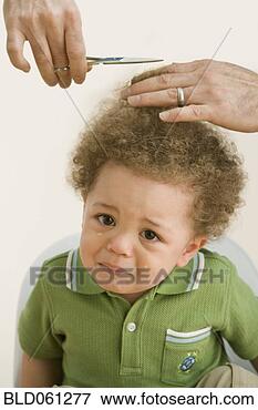 Picture - crying mixed race 
baby getting hair 
cut. fotosearch 
- search stock 
photos, pictures, 
images, and photo 
clipart