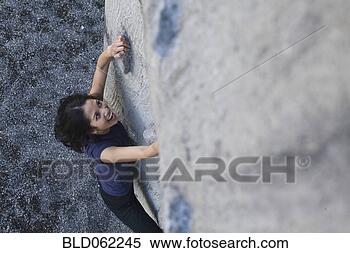 Stock Image - filipino woman 
rock climbing. 
fotosearch - search 
stock photos, 
pictures, images, 
and photo clipart