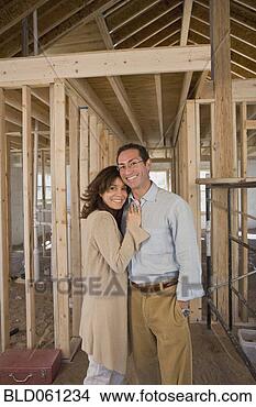 Stock Photo - hispanic couple 
at new construction 
site. fotosearch 
- search stock 
photos, pictures, 
images, and photo 
clipart