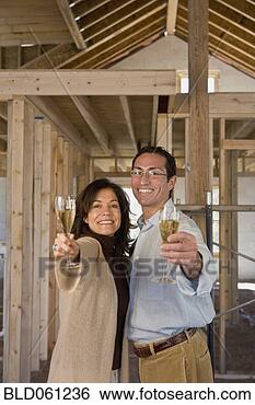 Stock Photo - hispanic couple 
toasting champagne 
at new construction 
site. fotosearch 
- search stock 
photos, pictures, 
images, and photo 
clipart