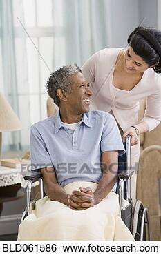 Stock Photo - middle eastern 
woman smiling 
at man in wheelchair. 
fotosearch - search 
stock photos, 
pictures, images, 
and photo clipart