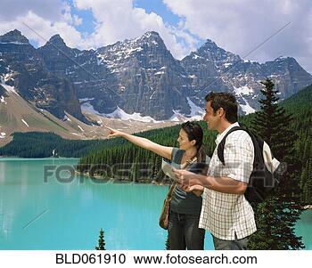 Stock Photography - mixed race couple 
hiking in mountains. 
fotosearch - search 
stock photos, 
pictures, images, 
and photo clipart