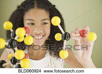 Stock Photo - mixed race girl 
holding molecule 
model. fotosearch 
- search stock 
photos, pictures, 
images, and photo 
clipart