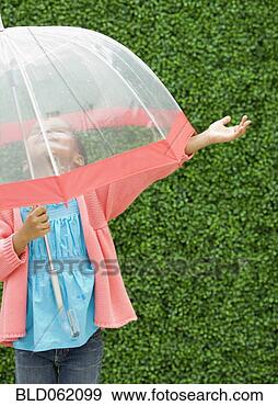 Mixed race girl with umbrella in the rain
View Large Photo Image Stock Photograph - mixed race girl
with umbrella
in the rain. fotosearch
- search stock
photos, pictures,
images, and photo
clipart