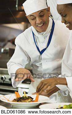 Stock Photo - multi-ethnic chefs 
discussing food. 
fotosearch - search 
stock photos, 
pictures, images, 
and photo clipart