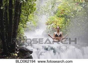 Stock Photo - woman practicing 
yoga in middle 
of stream. fotosearch 
- search stock 
photos, pictures, 
images, and photo 
clipart