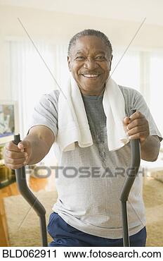 Stock Photography - african man working 
out on exercise 
equipment. fotosearch 
- search stock 
photos, pictures, 
images, and photo 
clipart