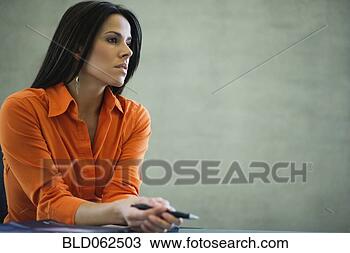 Stock Photo - latin american 
businesswoman 
looking pensive 
in office. fotosearch 
- search stock 
photos, pictures, 
images, and photo 
clipart