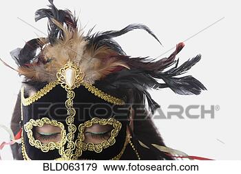 Stock Photograph - mixed race woman 
wearing elaborate 
mask. fotosearch 
- search stock 
photos, pictures, 
images, and photo 
clipart