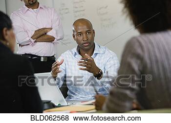 Stock Photo - multi-ethnic business 
people in meeting. 
fotosearch - search 
stock photos, 
pictures, images, 
and photo clipart