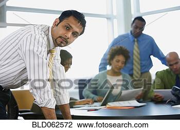 Stock Photo - multi-ethnic business 
people in meeting. 
fotosearch - search 
stock photos, 
pictures, images, 
and photo clipart