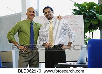 Stock Photography - multi-ethnic businessmen 
looking confident 
in office. fotosearch 
- search stock 
photos, pictures, 
images, and photo 
clipart